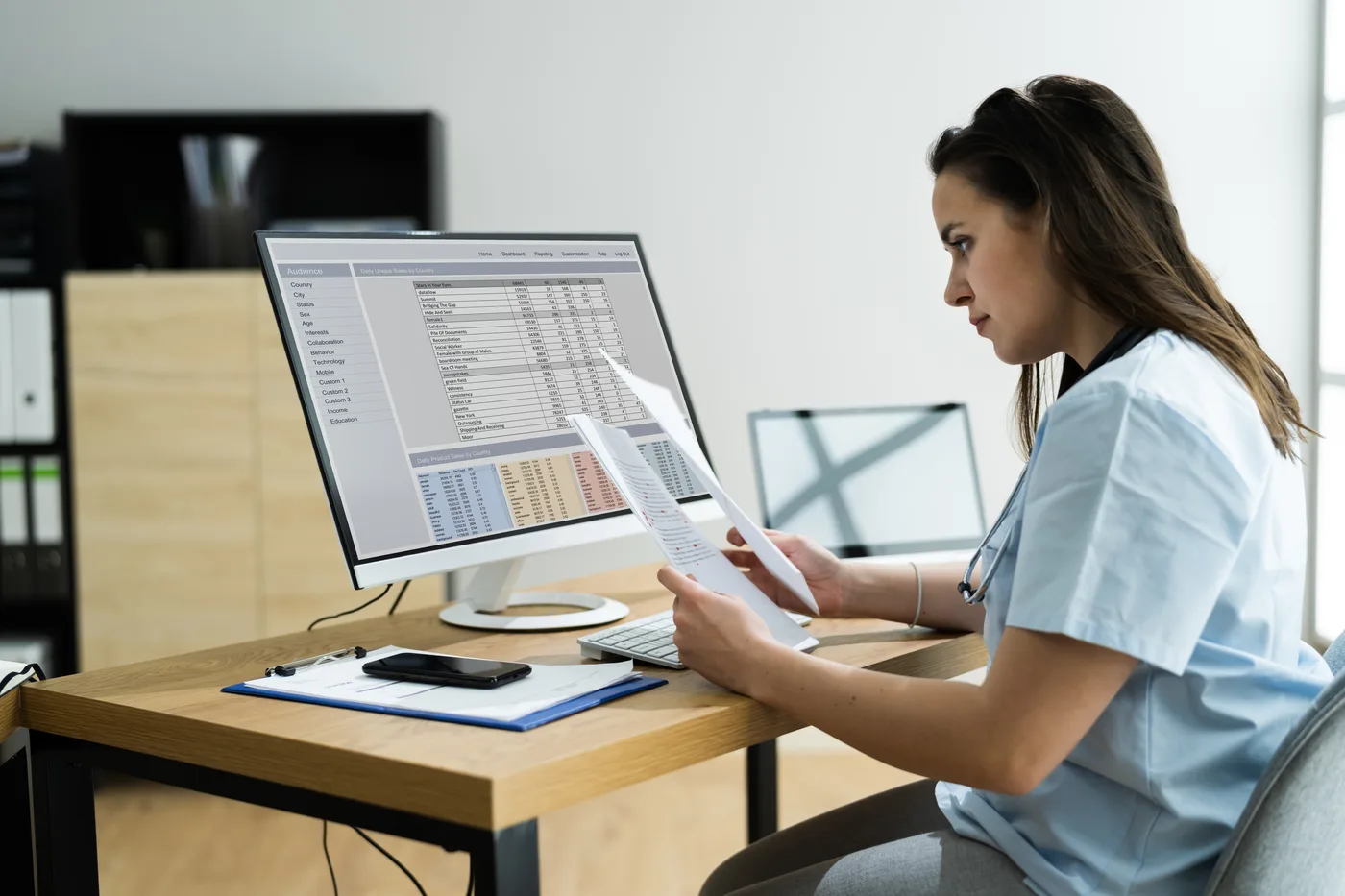 Medical billing specialist reviewing claim information